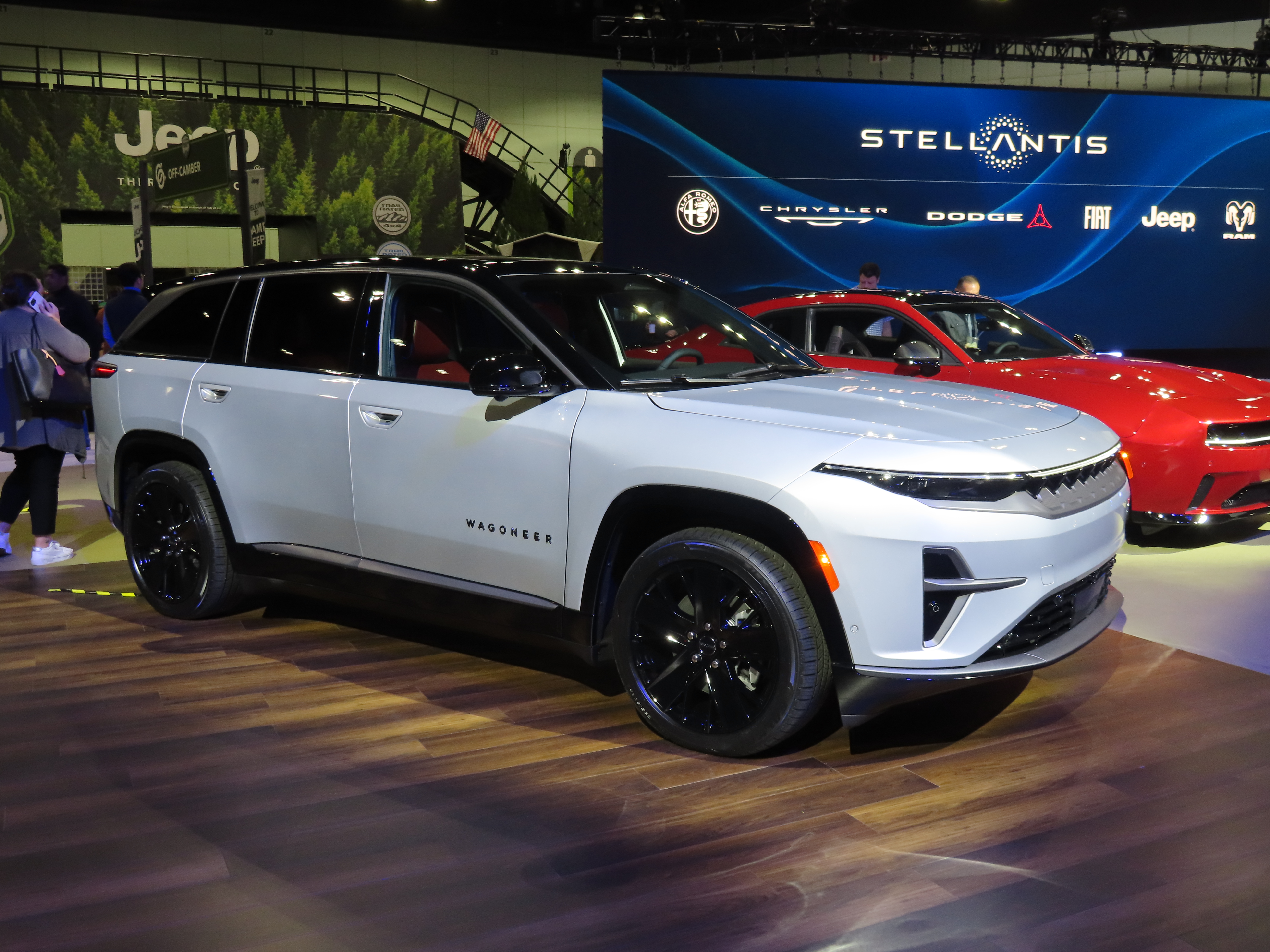 A white Jeep Wagoneer S on an auto-show floor.