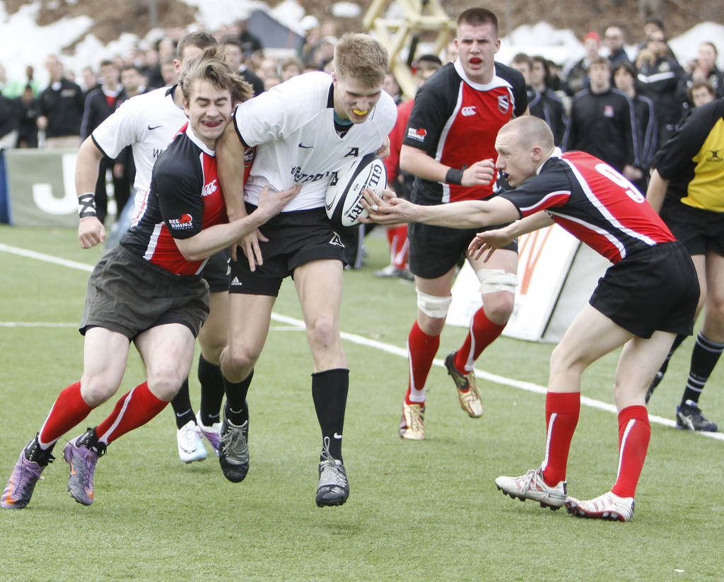 Army’s ball carrier meets Rutgers defenders.
