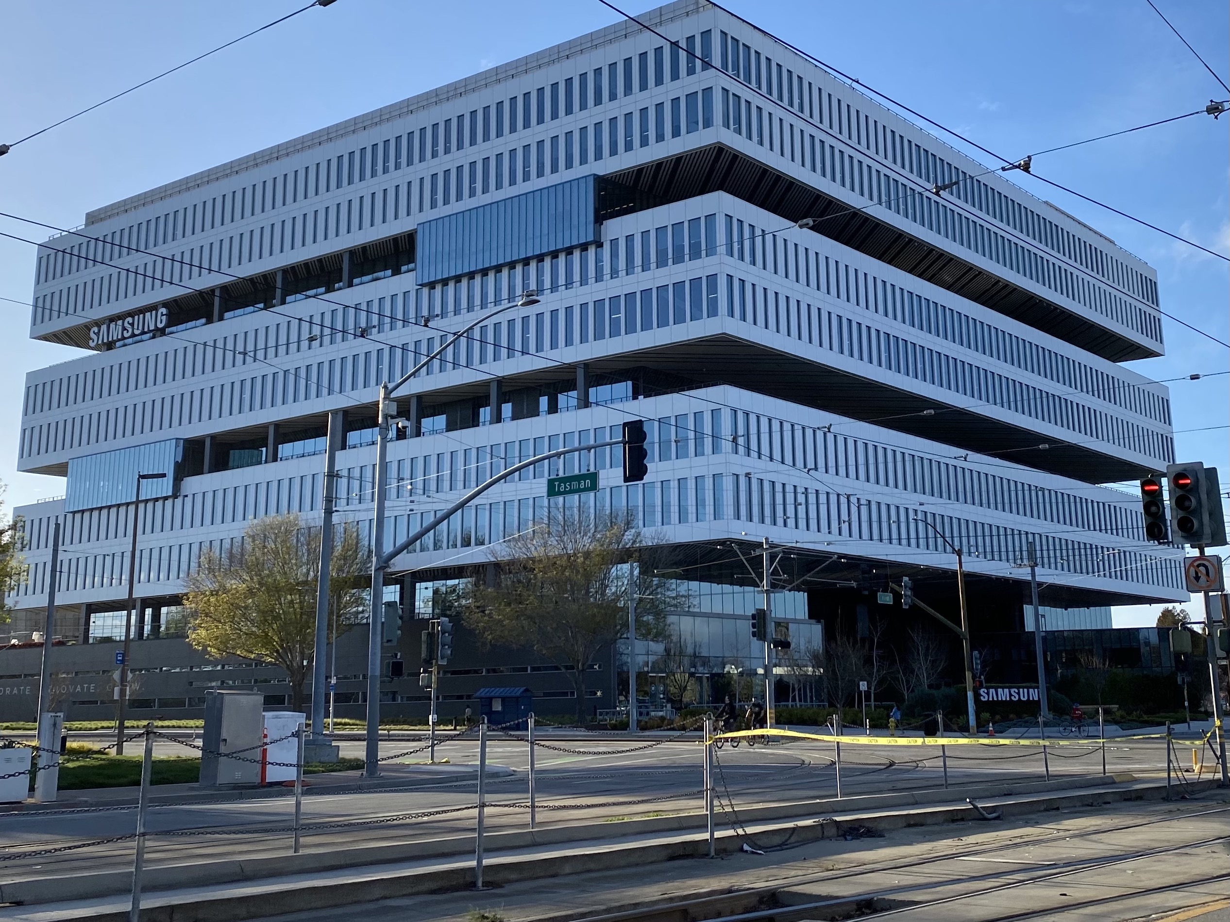 Samsung office building with stacked floors beside a San Jose intersection.
