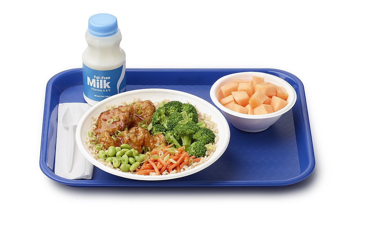 A school lunch tray with multiple food groups.