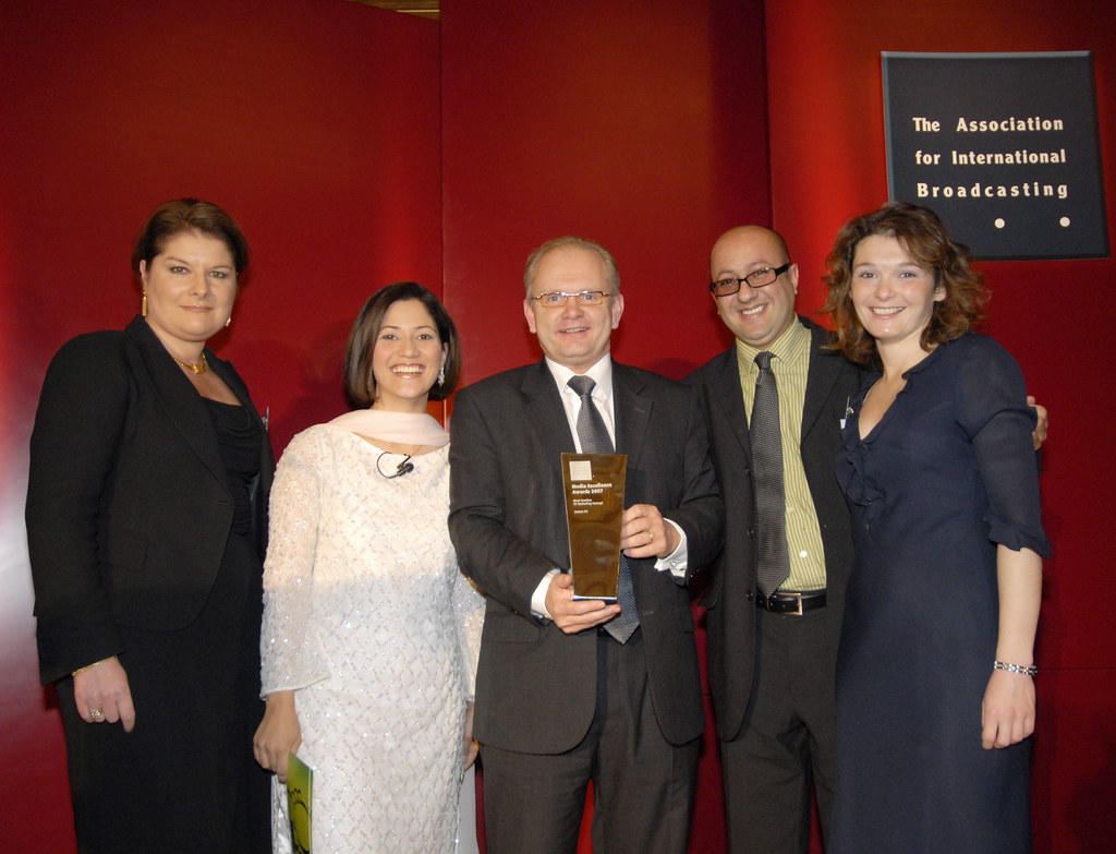 Archive: team holding an award.