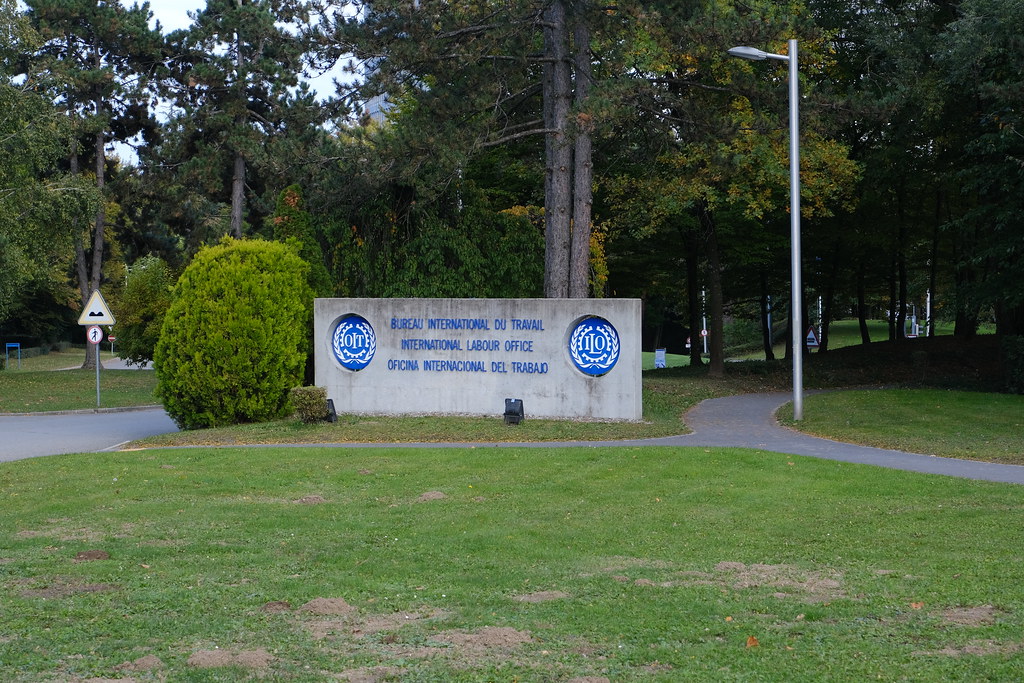 ILO entrance sign among trees in Geneva.