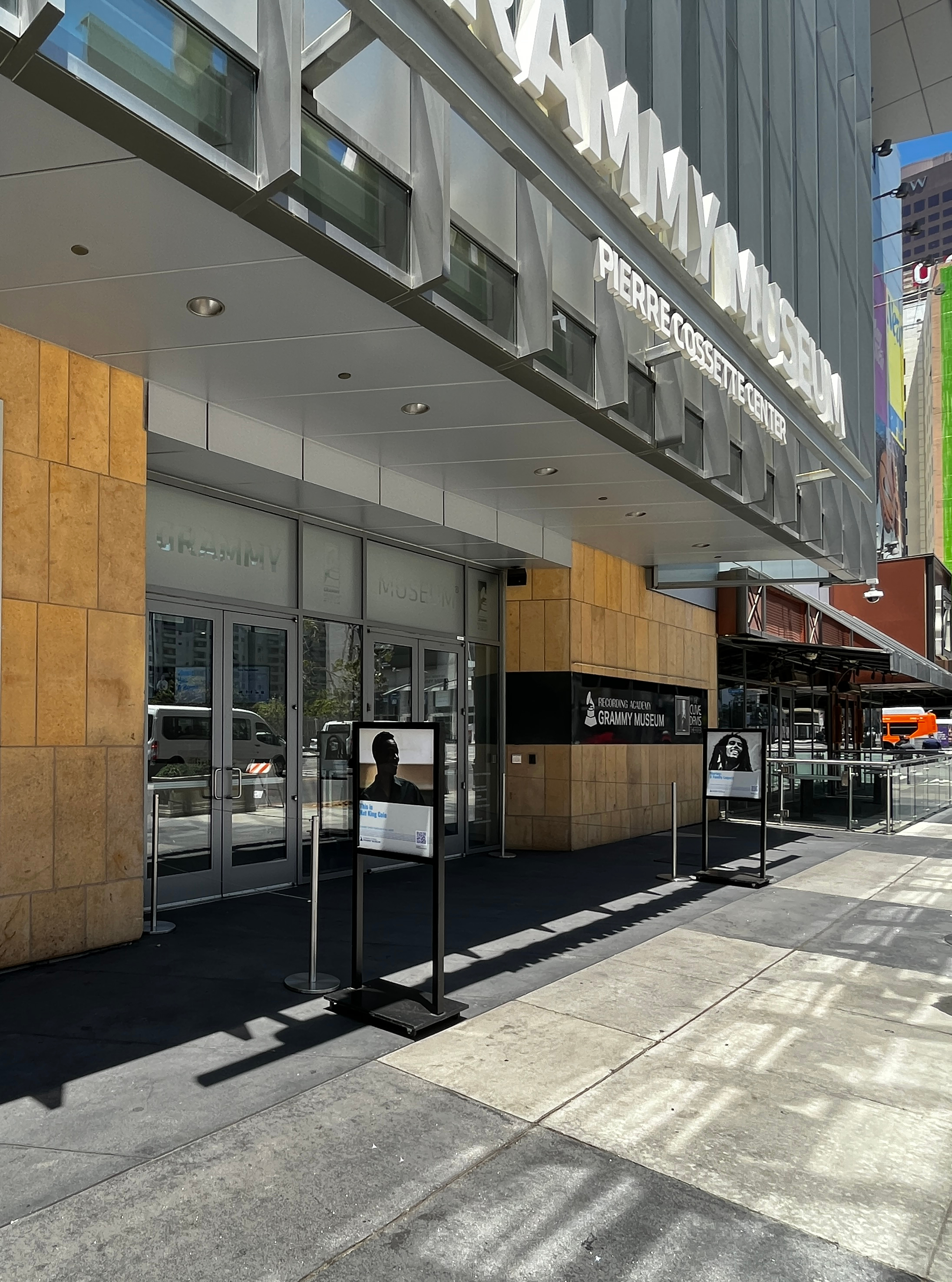 Grammy Museum exterior and entrance on a sunny sidewalk.