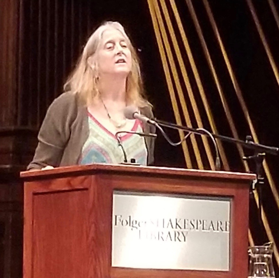 A poet at a lectern.