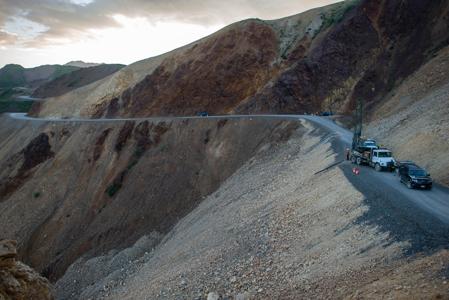 Drilling vehicles on a mountain road.