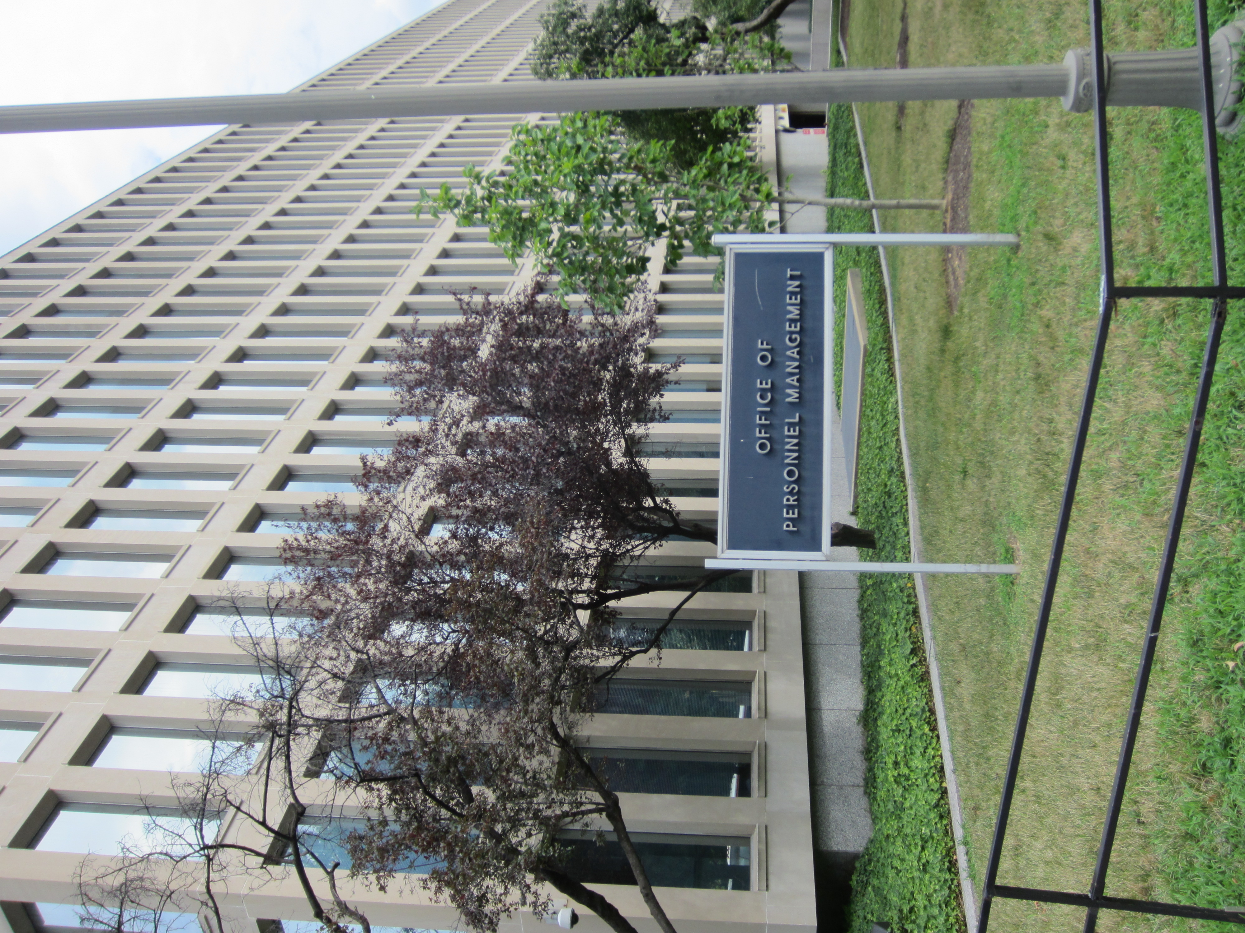 An Office of Personnel Management sign beside its office building.