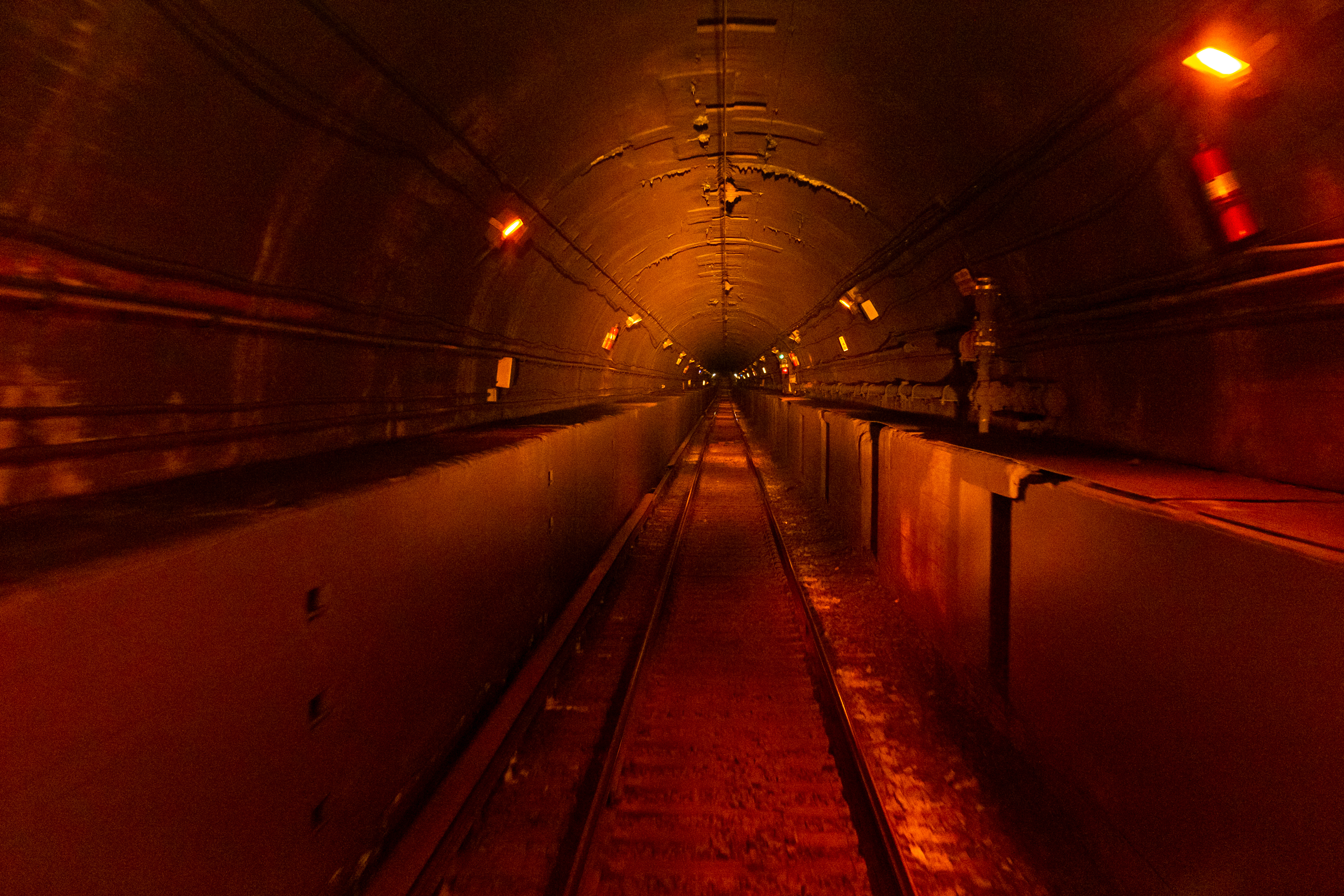 Rail tracks entering an East River Tunnel toward Penn Station.