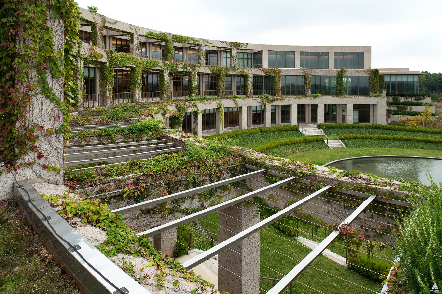 A landscaped courtyard and glass-fronted buildings at the Library of Congress Packard Campus.