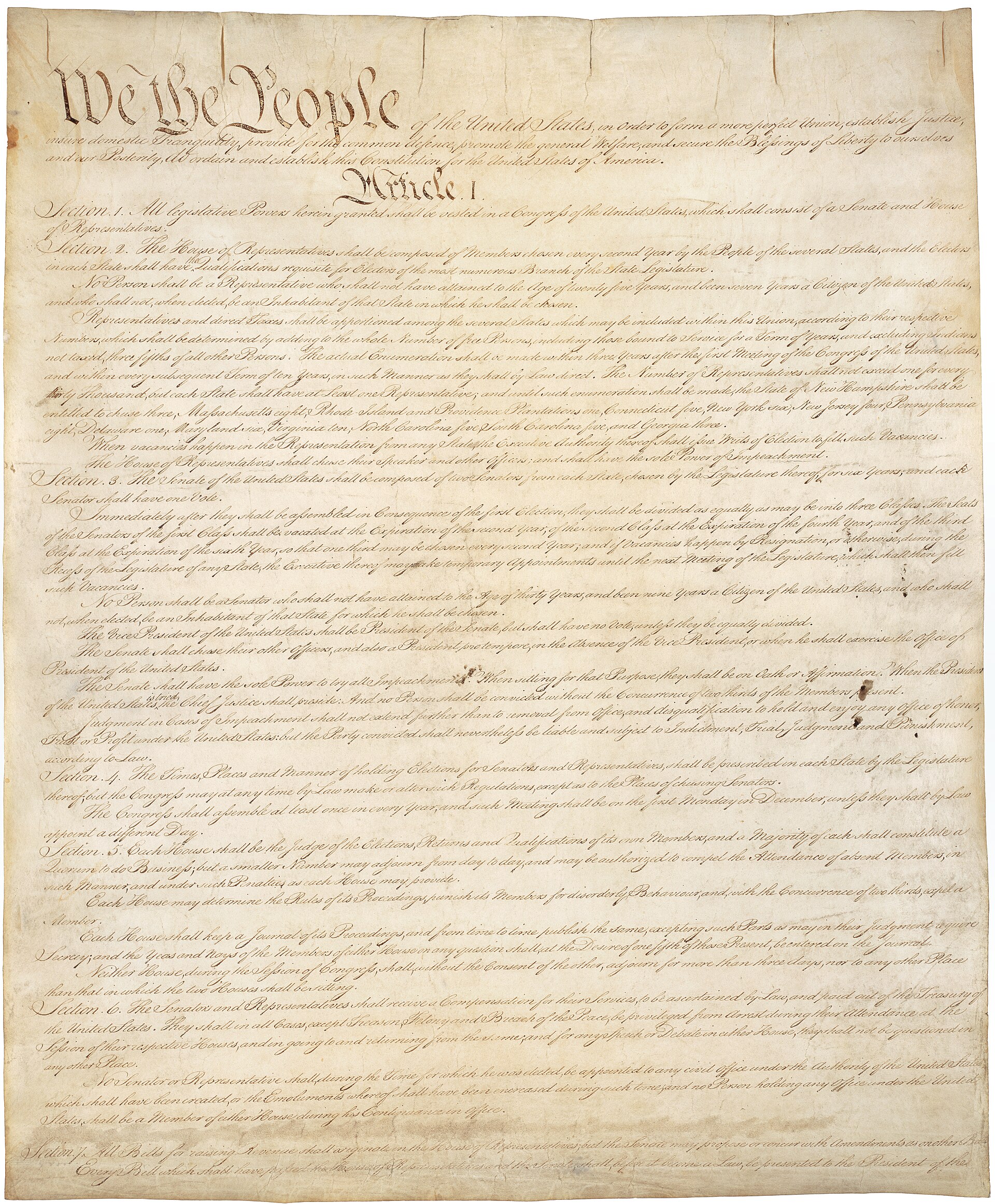First page of the United States Constitution with its opening words and handwritten text.