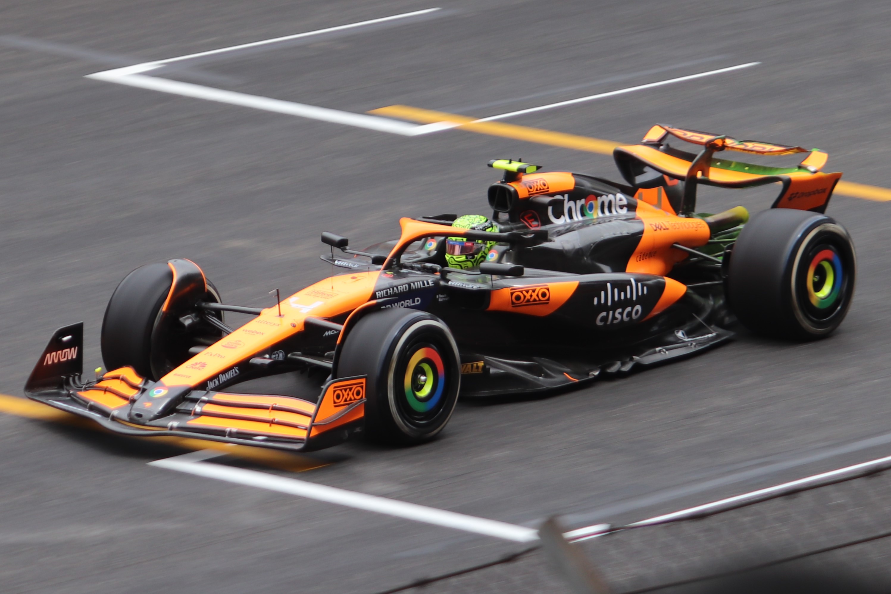 Norris’s orange McLaren on a circuit.