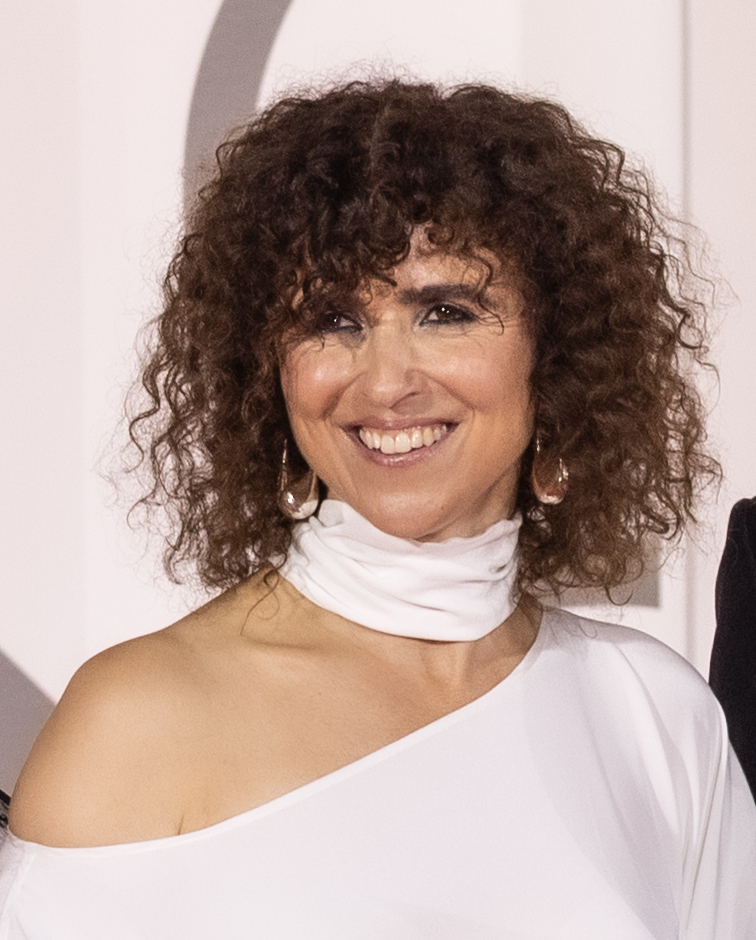 May el-Toukhy smiling in a white outfit at the Venice Film Festival