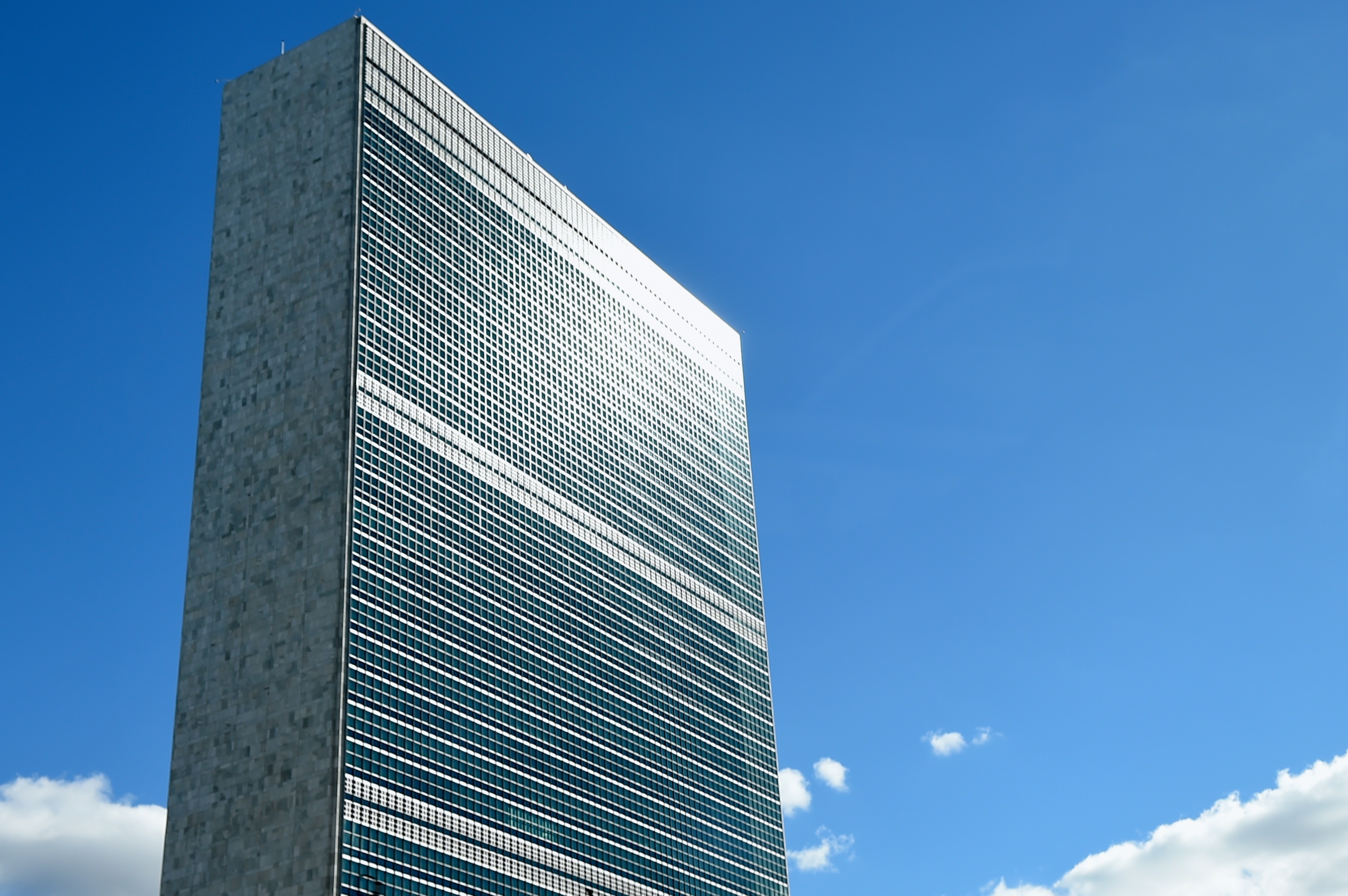 United Nations Secretariat tower reflecting sunlight.